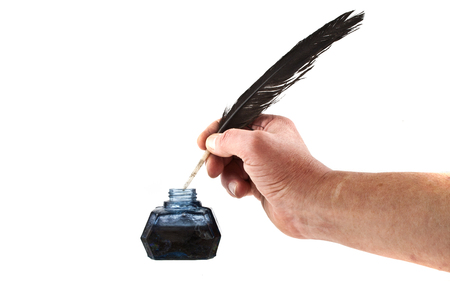 inkpot with feather isolated on white backgroundの写真素材