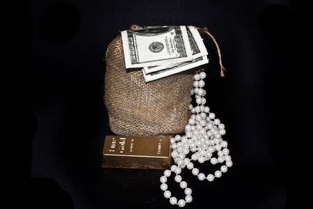 bag with money isolated on black backgroundの写真素材