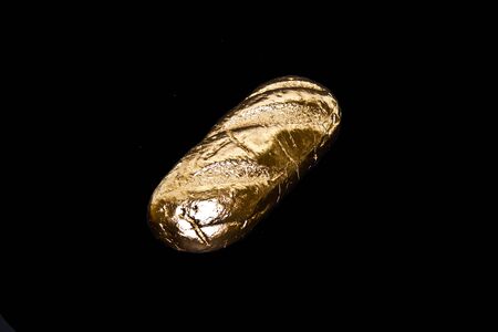 golden loaf isolated on white background