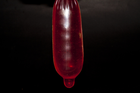 condom isolated on black backgroundの写真素材