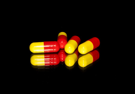 medical pills isolated on a black background