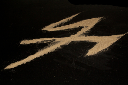 sand isolated on black backgroundの写真素材