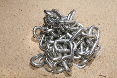 chain on sand backgroundの写真素材