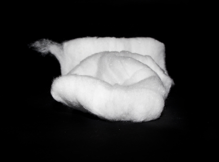 cotton wool isolated on black backgroundの写真素材