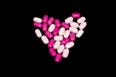 medical pills isolated on black backgroundの写真素材