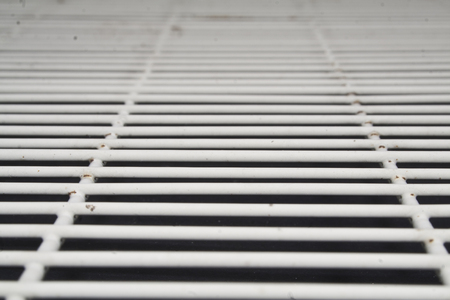 metal grill on black backgroundの写真素材