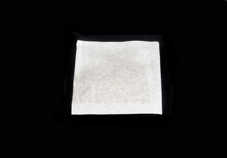tea bag isolated on black background