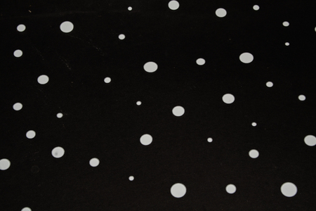 white dots on black background