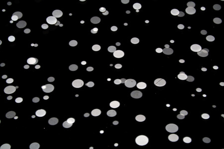 white dots on black backgroundの写真素材