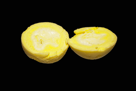 egg isolated on black backgroundの写真素材