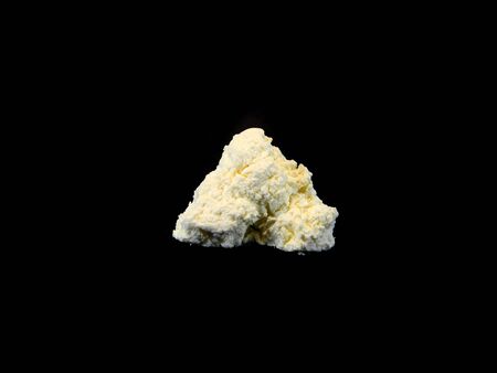 cottage cheese isolated on black backgroundの写真素材