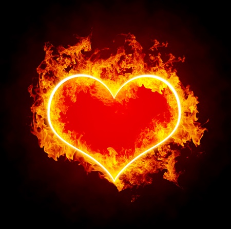 Abstract burning heart on black background の写真素材
