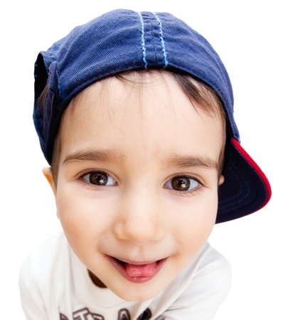 Portrait of a boy wearing a cap with a tongue isolated on whiteの写真素材