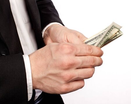 Businessman holding money in his handsの写真素材