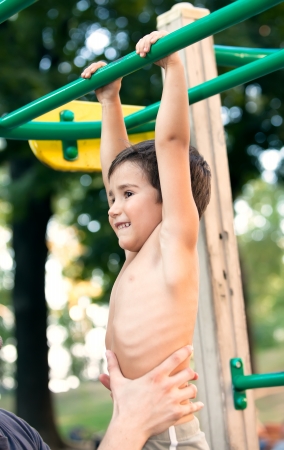 Boy 3-4 years old engaged in sports on the playground