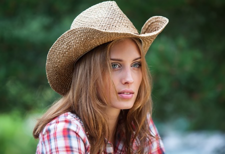 Sexy cowgirl. Young woman portrait in a hatの写真素材