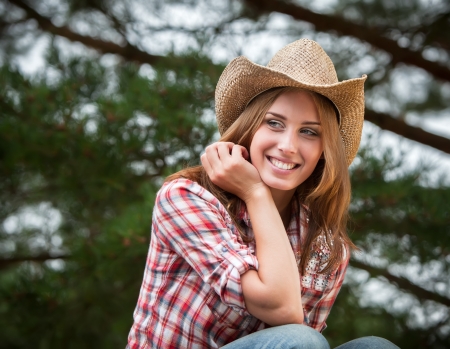 Sexy cowgirl. Young woman portrait in a hatの写真素材