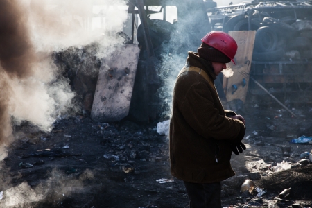 KIEV, UKRAINE - January 26, 2014: Mass anti-government protests in the center of Kiev. Euromaidan protesters rest and strengthen the barricades after night of clashes with riot policeのeditorial素材