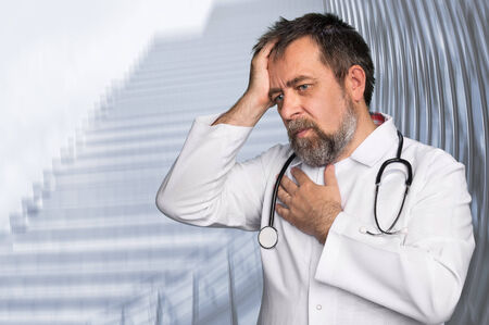 Thoughtful doctor. Portrait of a doctor with stethoscope