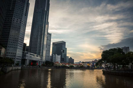 SINGAPORE - DECEMBER 9, 2014: View of the sculpture composition of the \"First Generation\" sculptor by Chong Fah Cheong on the Singapore River, District Riverside. Near the The Fullerton Hotel.のeditorial素材