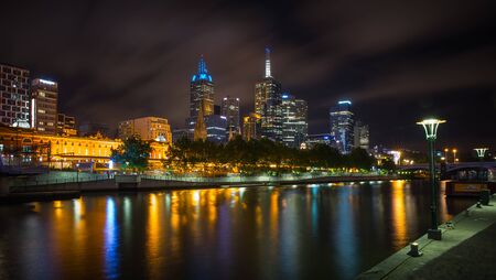 MELBOURNE, AUSTRALIA - DECEMBER 10, 2014: Melbourne skyline along the Yarra River at dusk. Melbourne is the capital and most populous city in the state of Victoria, and the second most populous city in Australiaのeditorial素材