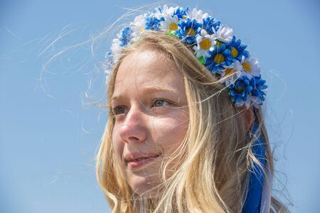 KIEV, UKRAINE - May. 09, 2015: Young woman in a wreath of flowers during the celebration of Victory Day in the square near the National Museum of the Great Patriotic Warのeditorial素材