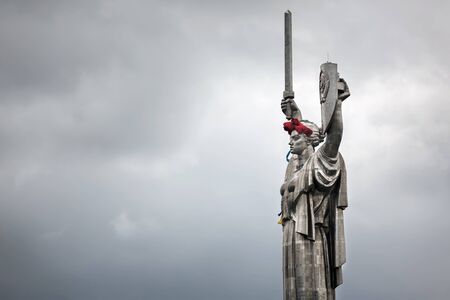 KIEV, UKRAINE - May. 08, 2015: Poppies of memory. The monument "Mother Motherland" decorated with a wreath of poppies on the Day of Remembrance and Reconciliation in Kievのeditorial素材