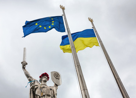 KIEV, UKRAINE - May. 08, 2015: Flags of the European Union and Ukraine against monumental statue of the "Mother Motherland" devoted the Great Patriotic Warのeditorial素材