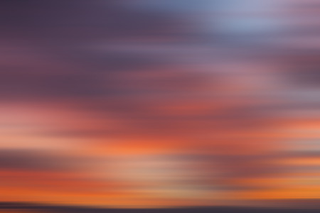 Blurred sunset cloudy sky backgroundの写真素材