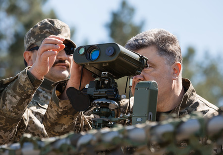 CHERNIHIV REG, UKRAINE - May. 11, 2015: President of Ukraine Petro Poroshenko, examines the latest...