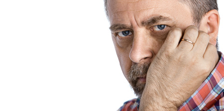 Portrait of a thoughtful middle age man with hand near the face. Isolated on white with copy-spaceの写真素材