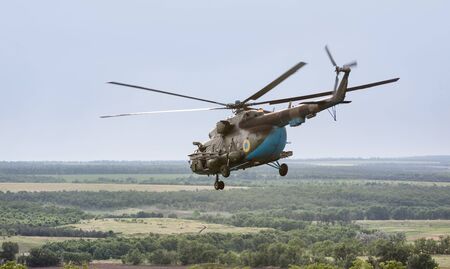 DONETSK REG, UKRAINE - Jun 11, 2015: Ukrainian military helicopter in flight on combat duty in the area of the antiterrorist operationのeditorial素材