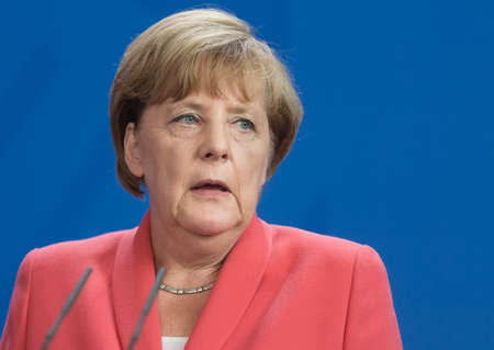 BERLIN, GERMANY - Aug 24, 2015: Chancellor of the Federal Republic of Germany Angela Merkel during a joint briefing with President of Ukraine Petro Poroshenko and French President Francois Hollandeのeditorial素材