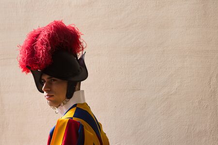 VATICAN CITY, VATICAN - Nov 20, 2015: Papal Swiss Guard in uniform. Currently, the name Swiss Guard generally refers to the Pontifical Swiss Guard of the Holy See stationed at the Vatican in Romeのeditorial素材