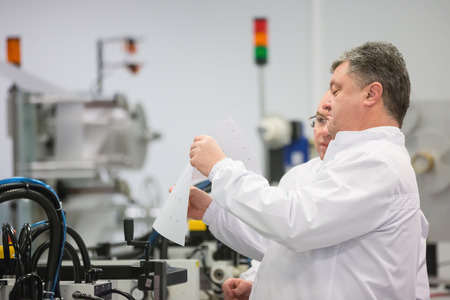 KIEV, UKRAINE - Dec 14, 2015: President of Ukraine Petro Poroshenko launched production of new passport of Ukrainian citizen on the State enterprise Polygraph Combine Ukraineのeditorial素材