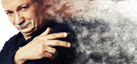 Portrait of a successful elderly with a dust explosion.  High-contrast image with intentional color shiftの写真素材