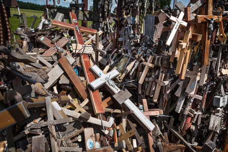 Hill of Crosses is a unique monument of history and religious folk art in Siauliai, Lithuania. Text on the crosses in different languages - O God, protect our family, give health.のeditorial素材