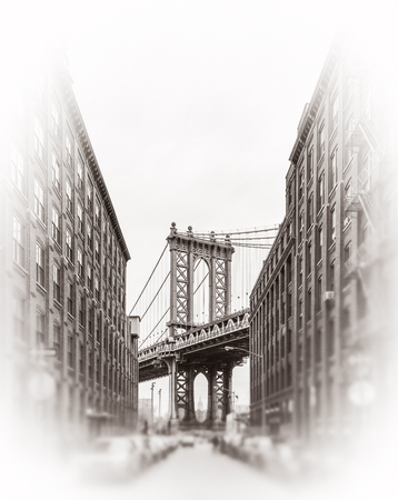 Manhattan Bridge and Empire State Building seen from Brooklyn, New York. Black and white image with a blurred foreground. Old photo stylization, film grain added. Sepia tonedの写真素材