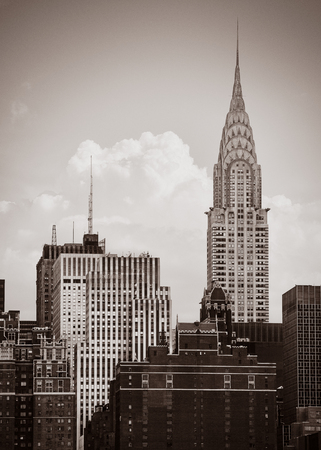 Chrysler Building. The Chrysler Building is an Art Deco-style skyscraper located on the East Side of Midtown Manhattan in New York City. Old photo stylization, film grain added. Sepia tonedのeditorial素材