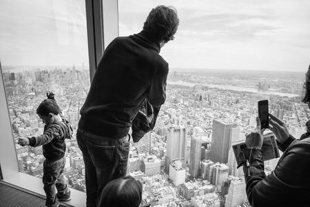 NEW YORK, USA - Apr 28, 2016: People in One World Observatory. This observation deck is located at the top of One World Trade Center, the tallest building in New York City.のeditorial素材