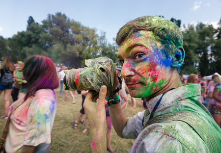 KIEV, UKRAINE - Jun 25, 2016: Crowd of happy young people have fun in colors during festival of colors ColorFestのeditorial素材
