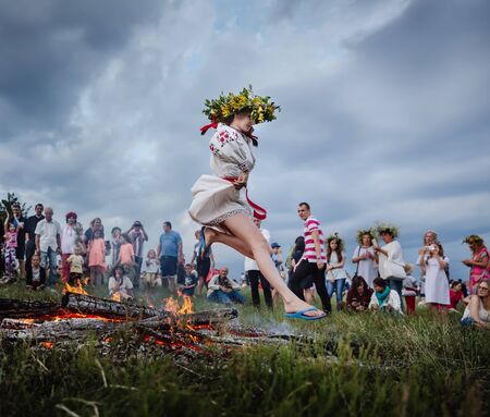 KIEV, UKRAINE - JULY 06: Slavic celebrations of Ivana Kupala. Young people jump over the flames of...