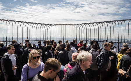 NEW YORK, USA - Apr 30, 2016: Tourists enjoying the breathtaking views of New York City from the observation deck of Empire State Buildingのeditorial素材