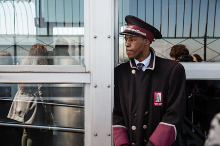 NEW YORK, USA - Apr 30, 2016: Security guard on the observation deck of the Empire State Building in New York Cityのeditorial素材