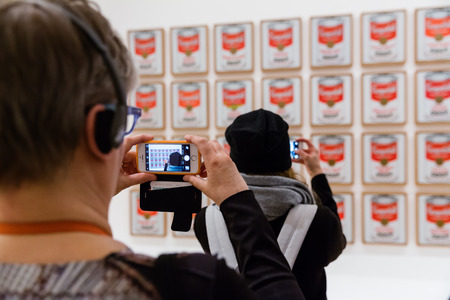 NEW YORK, USA - May 01, 2016: People inside Museum of Modern Art. MoMAs collection offers an overview of modern and contemporary art, architecture, design, drawing, painting, sculpture, photographyのeditorial素材