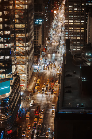 NEW YORK, USA - Sep 20, 2016: Streets of Manhattan at night. Manhattan is the most densely populated of the five boroughs of New York Cityのeditorial素材