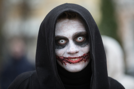 KIEV, UKRAINE - Oct 30, 2016: Zombie Walk. Young people taking part in a zombie parade in the streets of Kiev, to celebrate Halloween.Street performer in Halloween costume and makeup.のeditorial素材