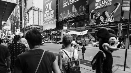 NEW YORK, USA - Sep 18, 2016: New York and New Yorkers. Manhattan street scene. Man dressed as Mickey Mouse in a crowd of people on the streets of Manhattanのeditorial素材