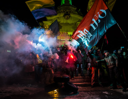 KIEV, UKRAINE - Nov 21, 2016: Activists of nationalist groups burn tyres in Independence Square as they gather to mark the anniversary of 2014 Ukrainian pro-European Union mass protestsのeditorial素材