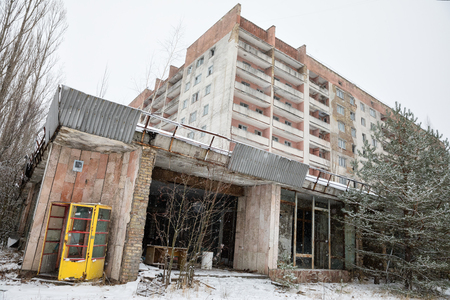 CHERNOBYL REG, UKRAINE - Nov 29, 2016: Chernobyl Exclusion Zone. Lost city. Ruins of buildings in the abandoned city of Pripyat. Winter in zone of exclusion. Zone of high radioactivityのeditorial素材